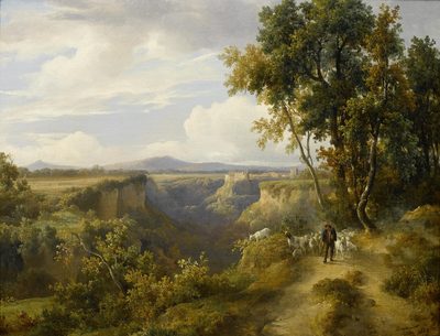A goatherder and his flock in an Italianate landscape, possibly Faleria