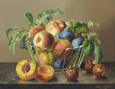 Peaches, plums and apples in a glass bowl by peaches on a marble ledge